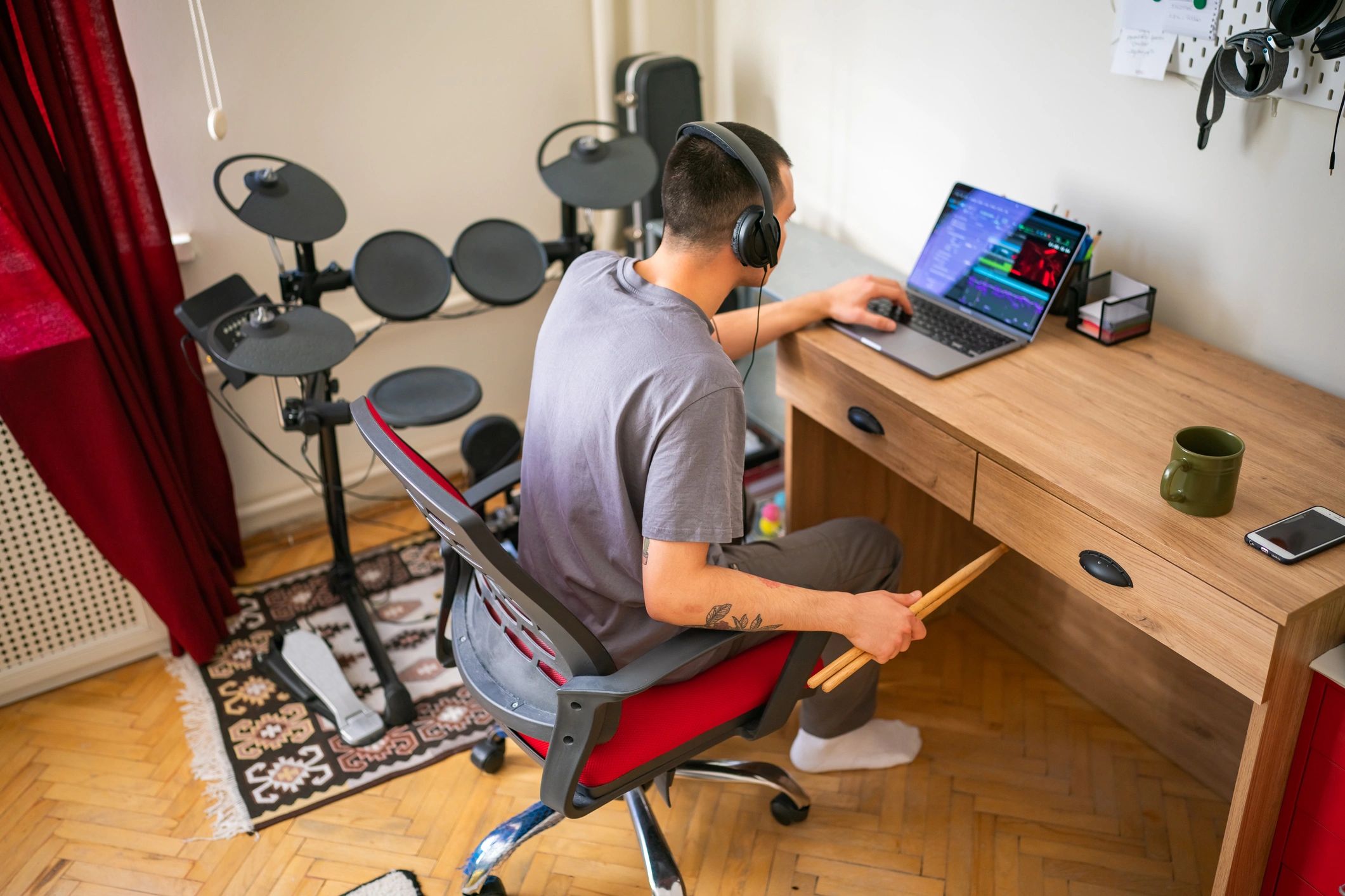 Independent musician learning and creating in a home studio