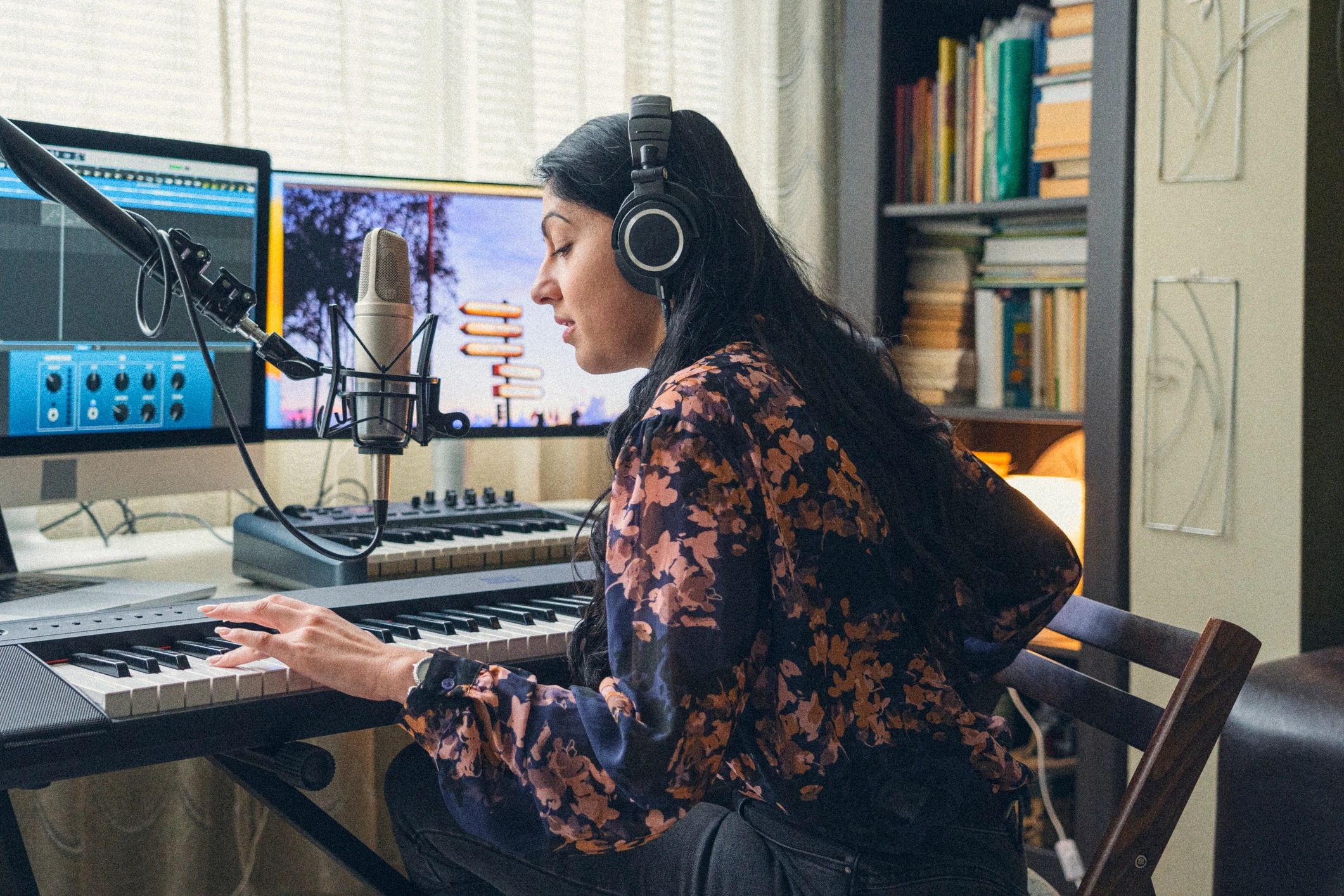 Female music producer recording in studio